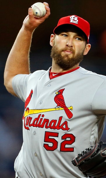Cardinals look to avoid being swept under the lights at Wrigley